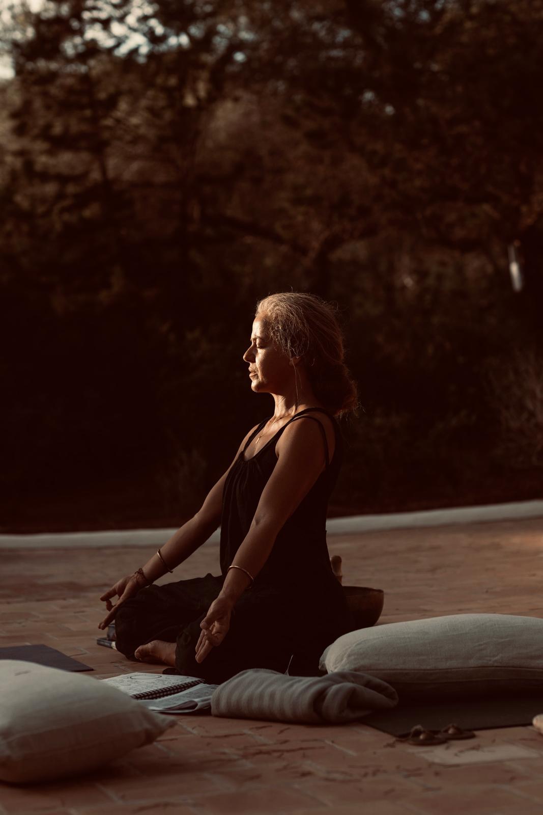 Lizaan in seated meditation in the evening sun